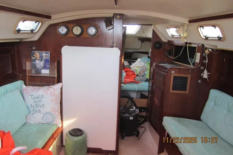 Slide: The Image of Interior of 1986 Catalina 30 MkII sailboat with cozy seating and nautical decor. - 61