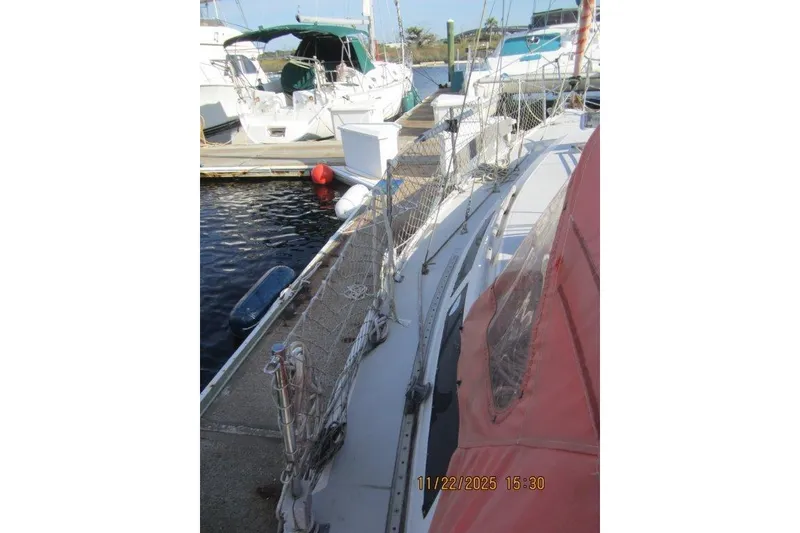 Slide: The Image of 1986 Catalina 30 MkII sailboat docked at marina, side view. - 65