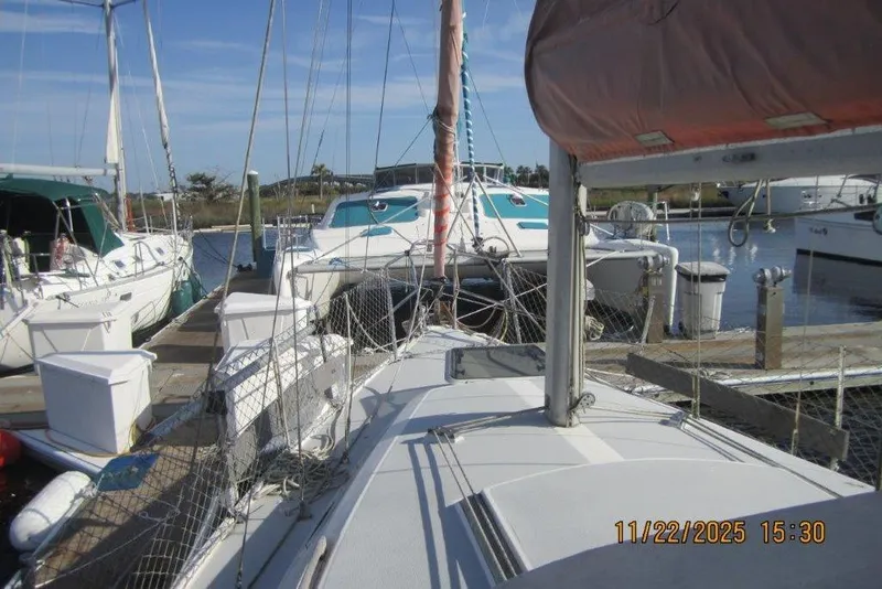 Slide: The Image of 1986 Catalina 30 MkII sailboat docked at marina with other boats. - 66