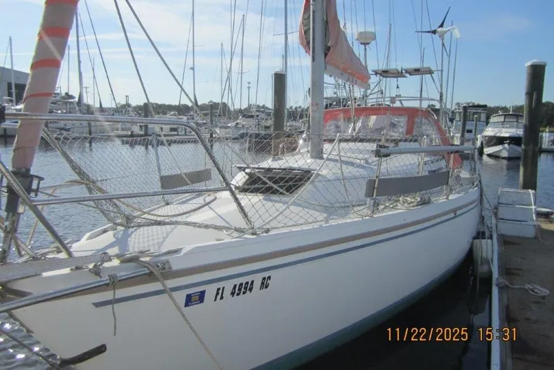 Slide: The Image of 1986 Catalina 30 MkII sailboat docked at marina, sunny day, clear sky. - 9