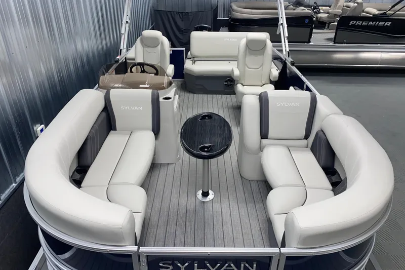 Slide: The Image of 2026 Sylvan Mirage 8522 CLZ DH pontoon boat with luxurious seating and sleek design. - 1