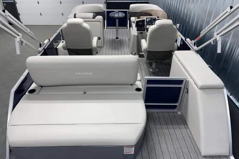 Slide: The Image of 2026 Sylvan Mirage 8522 CLZ DH pontoon boat interior with plush seating and modern helm. - 12