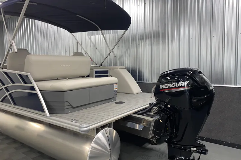 Slide: The Image of 2026 Sylvan Mirage 8522 CLZ DH pontoon boat with Mercury outboard motor in showroom. - 18