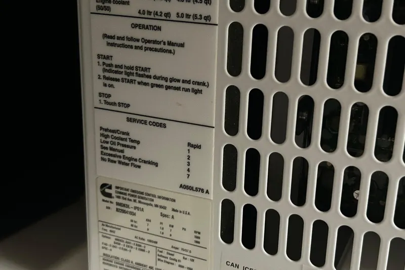 Slide: The Image of Close-up of a Cummins generator panel with operation instructions and service codes. - 19