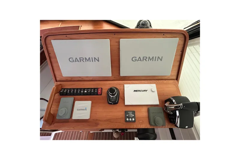 Slide: The Image of 2023 Back Cove 39O helm with Garmin and Mercury controls, featuring dual screens, Flir night vision, bow thruster and joystick. - 24