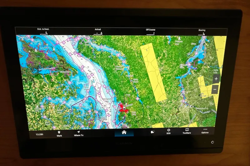 Slide: The Image of Garmin marine navigation display on 2023 Back Cove 39O, showing detailed coastal map. - 30
