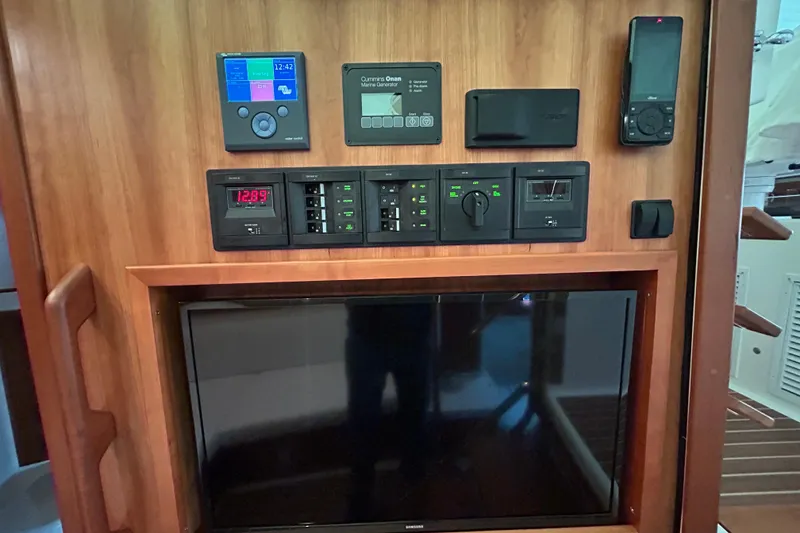 Slide: The Image of Distribution panel, mid cabin TV, VHF with AIS, and invertor/charger - 39