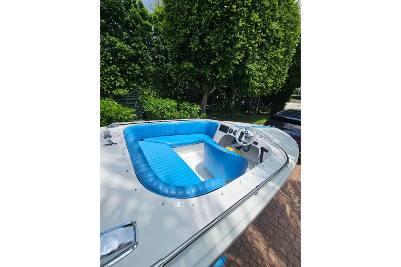 Slide: The Image of 1972 Donzi Sweet 16 Baby boat with blue interior, parked outdoors. - 6