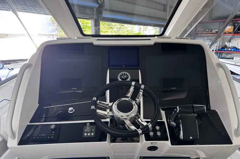 Slide: The Image of 2024 Deep Impact 399 Sport boat interior with speakers and stylish flooring. - 18