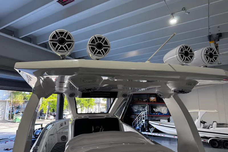 Slide: The Image of 2024 Deep Impact 399 Sport boat interior with luxurious white seating and modern design. - 21