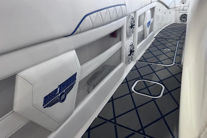 Slide: The Image of 2024 Deep Impact 399 Sport boat with luxurious white seating and sleek design. - 22