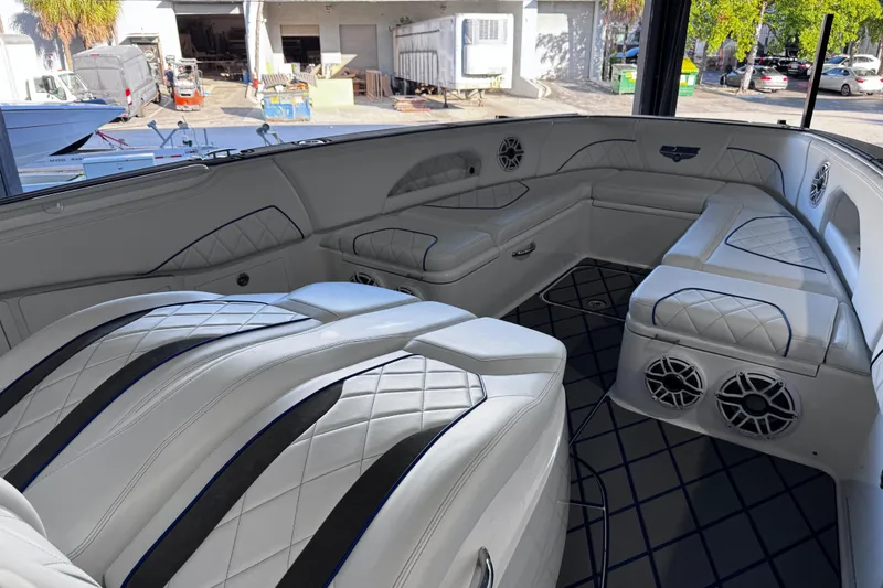 Slide: The Image of Interior view of 2024 Deep Impact 399 Sport boat dashboard with control panel and speakers. - 24