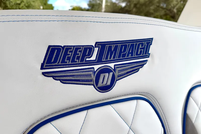 Slide: The Image of 2024 Deep Impact 399 Sport logo on white leather seat with blue stitching. - 30