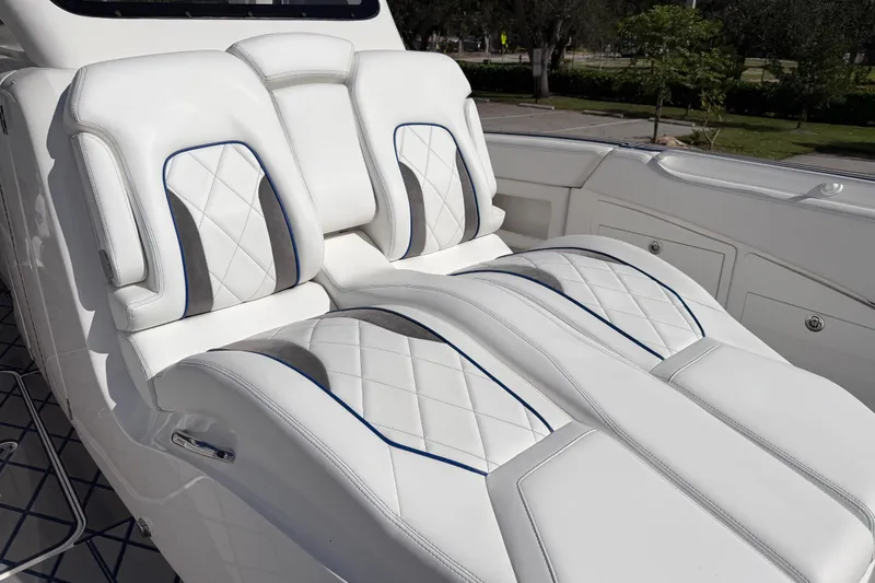 Slide: The Image of Luxurious white seating on 2024 Deep Impact 399 Sport boat, featuring elegant diamond stitching. - 34
