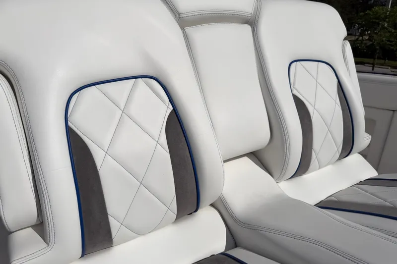 Slide: The Image of 2024 Deep Impact 399 Sport boat seats with white and gray diamond stitching. - 35