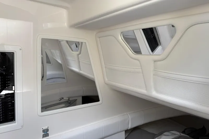 Slide: The Image of Interior of 2024 Deep Impact 399 Sport boat with sleek white design and modern features. - 36