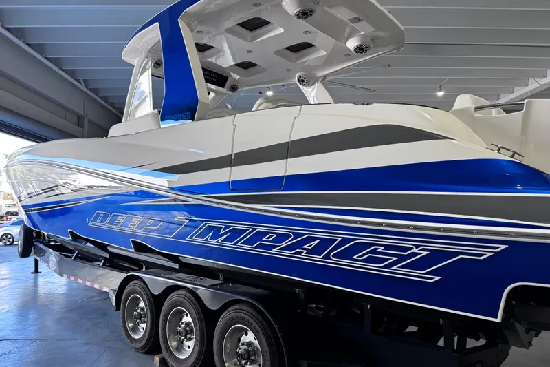 Slide: The Image of Four powerful outboard motors on a 2024 Deep Impact 399 Sport boat. - 8