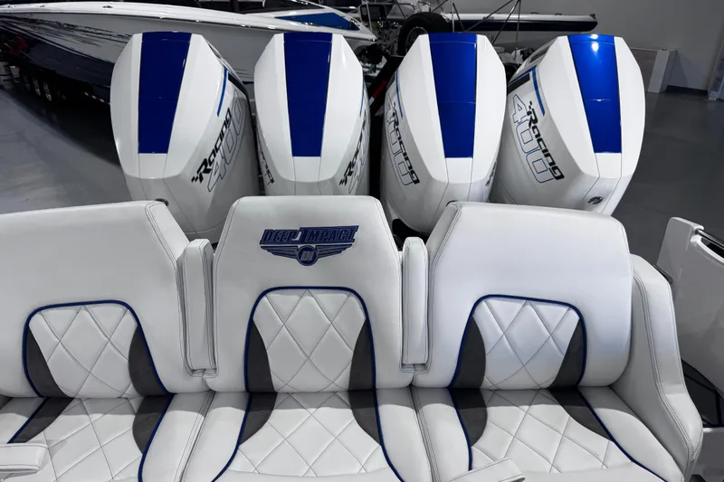 Slide: The Image of 2024 Deep Impact 399 Sport boat with luxurious seating and powerful engines. - 9