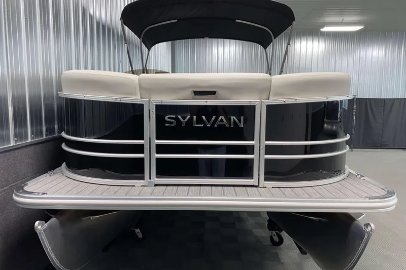 Slide: The Image of 2026 Sylvan Mirage 8522 LZ pontoon boat in a showroom setting. - 12