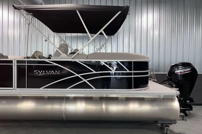 Slide: The Image of 2026 Sylvan Mirage 8522 LZ pontoon boat with Mercury engine in showroom. - 15
