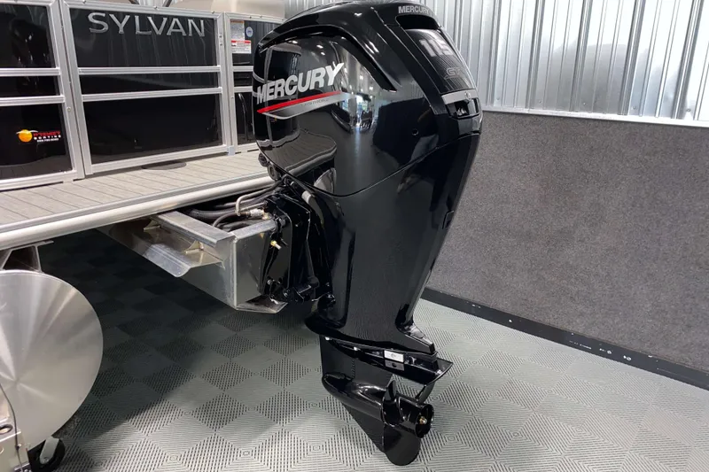 Slide: The Image of 2026 Sylvan Mirage 8522 LZ with Mercury outboard motor in showroom. - 16