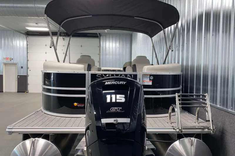 Slide: The Image of 2026 Sylvan Mirage 8522 LZ pontoon boat with Mercury 115 engine in a showroom. - 17