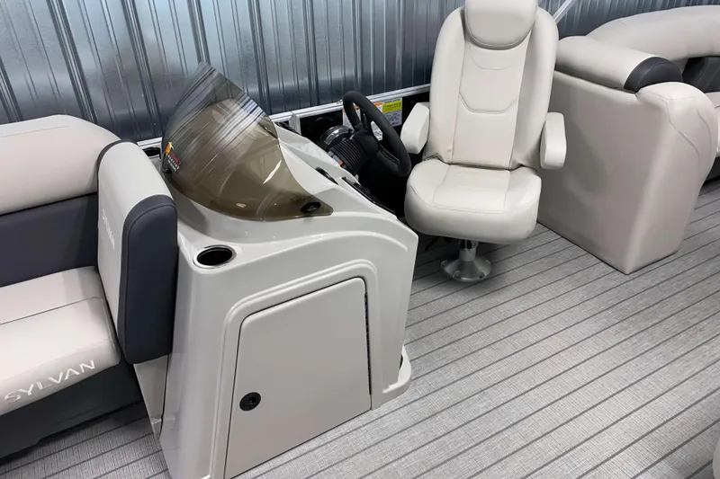 Slide: The Image of 2026 Sylvan Mirage 8522 LZ boat interior with helm and seating. - 5