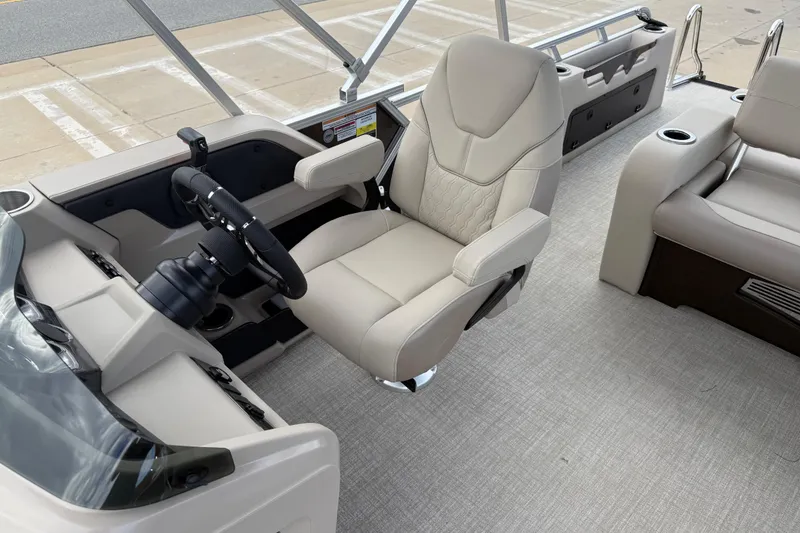 Slide: The Image of 2026 Avalon LSZ Versatile Rear Bench boat interior with luxurious seating and modern steering console. - 14