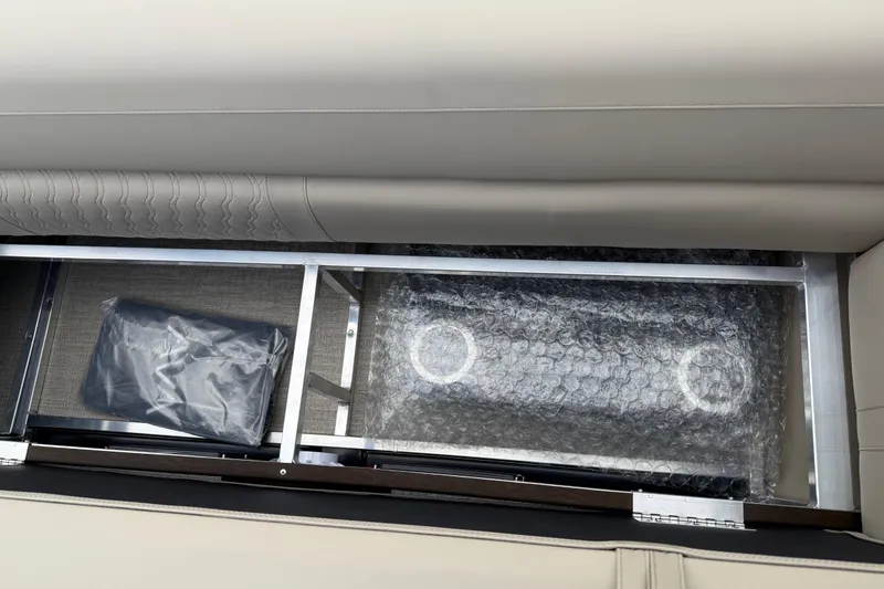 Slide: The Image of 2026 Avalon LSZ Versatile Rear Bench storage compartment with bubble wrap and packaged items. - 32