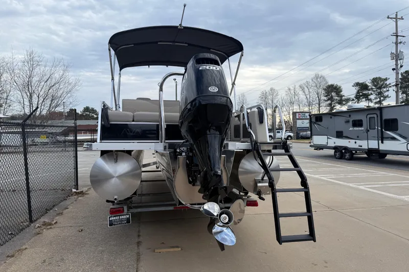 Slide: The Image of 2026 Avalon LSZ Versatile Rear Bench pontoon boat with outboard motor and ladder. - 4