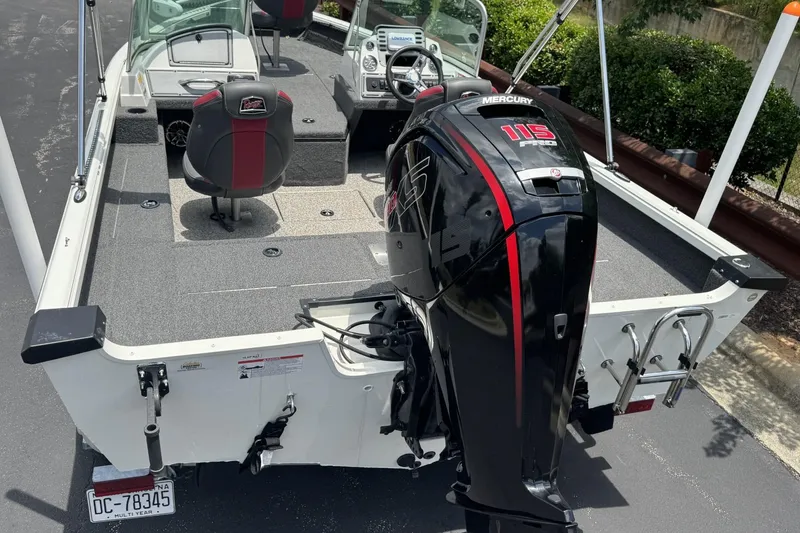 Slide: The Image of 2020 Ranger VS1682 WT boat with Mercury 115 engine, featuring spacious deck and seating. - 10