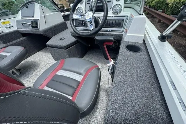 Slide: The Image of 2020 Ranger VS1682 WT boat interior with steering wheel, seats, and dashboard controls. - 9