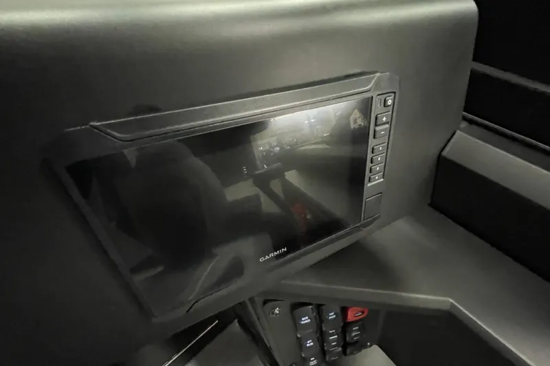 Slide: The Image of Garmin display on 2026 Alumacraft Competitor 175X Sport boat dashboard. - 16