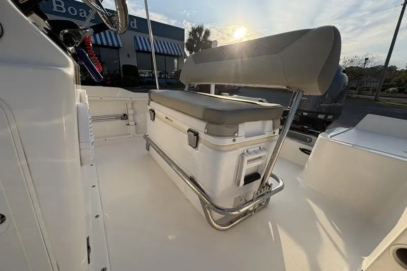 Slide: The Image of 2023 Key West 1720 Center Console boat interior with cushioned seating and storage. - 11