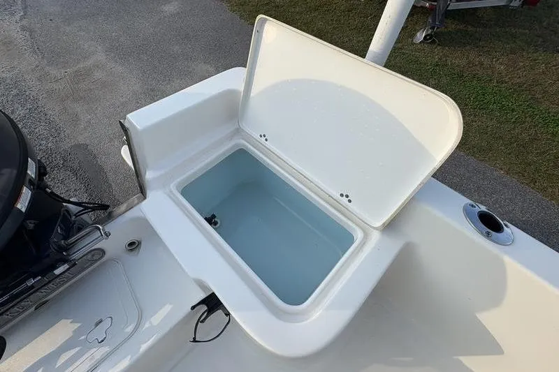 Slide: The Image of 2023 Key West 1720 Center Console boat with open storage compartment. - 12