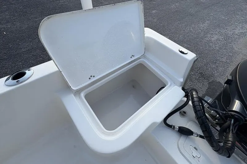 Slide: The Image of 2023 Key West 1720 Center Console boat with open storage compartment. - 13