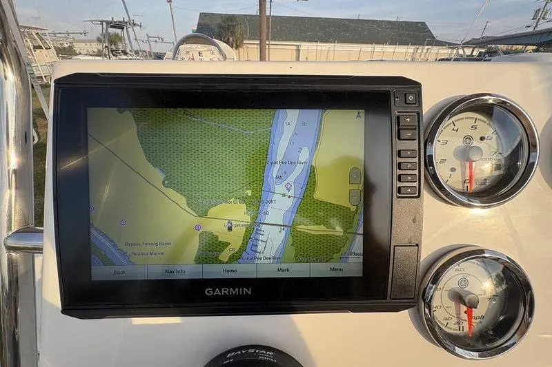 Slide: The Image of 2023 Key West 1720 Center Console with Garmin navigation display and gauges. - 15