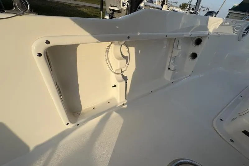 Slide: The Image of 2023 Key West 1720 Center Console boat interior with storage compartment and clean design. - 17