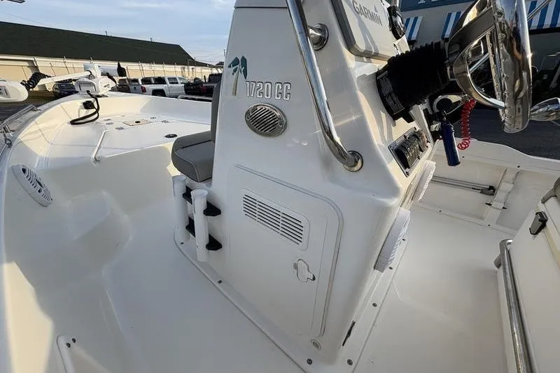 Slide: The Image of 2023 Key West 1720 Center Console boat interior with steering and seating. - 20