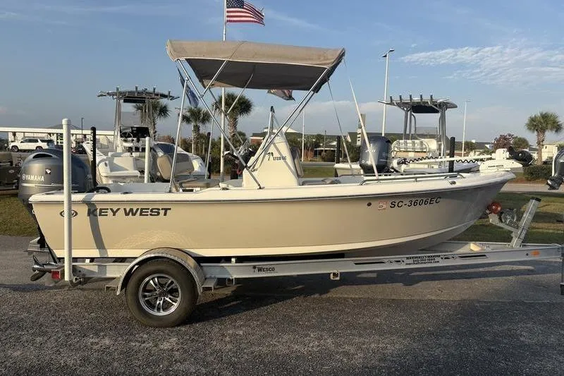 Slide: The Image of 2023 Key West 1720 Center Console boat on trailer, parked outdoors. - 5