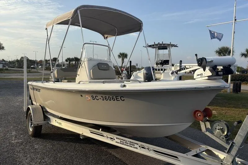 Slide: The Image of 2023 Key West 1720 Center Console boat on trailer, parked outdoors. - 6