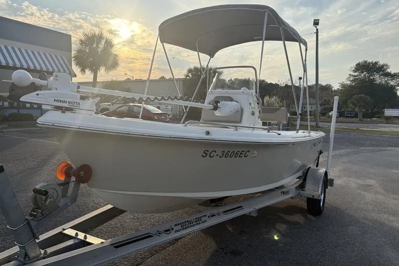 Slide: The Image of 2023 Key West 1720 Center Console boat on trailer at sunset. - 8