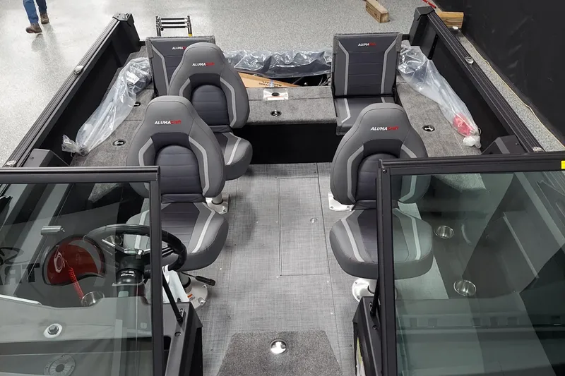 Slide: The Image of 2026 Alumacraft Competitor 175X Sport interior with four seats and steering wheel. - 5