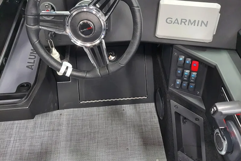 Slide: The Image of 2026 Alumacraft Competitor 175X Sport dashboard with Garmin system and steering wheel. - 8