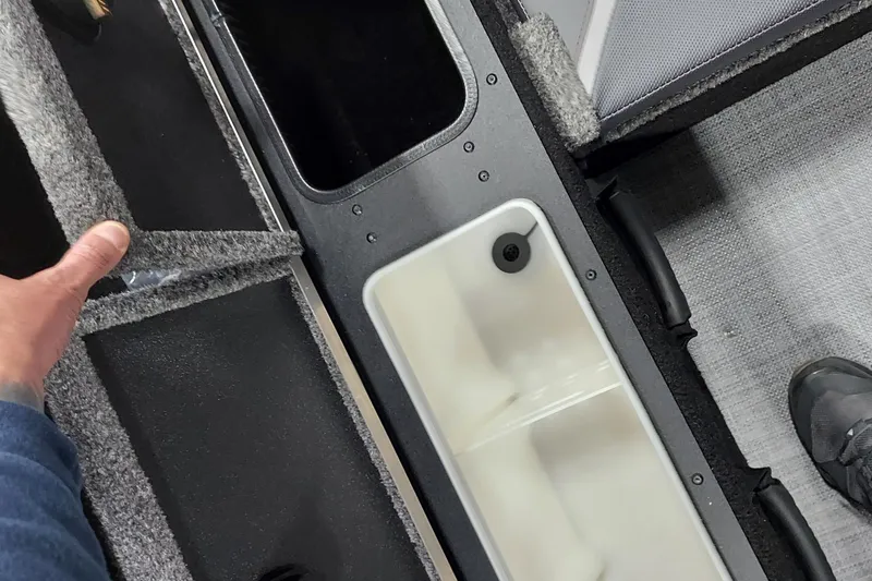 Slide: The Image of Interior view of 2026 Alumacraft Competitor 175X Sport boat storage compartments. - 9