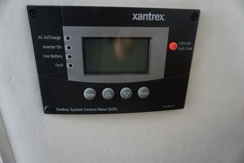 Slide: The Image of Xantrex control panel on 2015 Cruisers Yachts 328 BR, displaying system status indicators. - 10