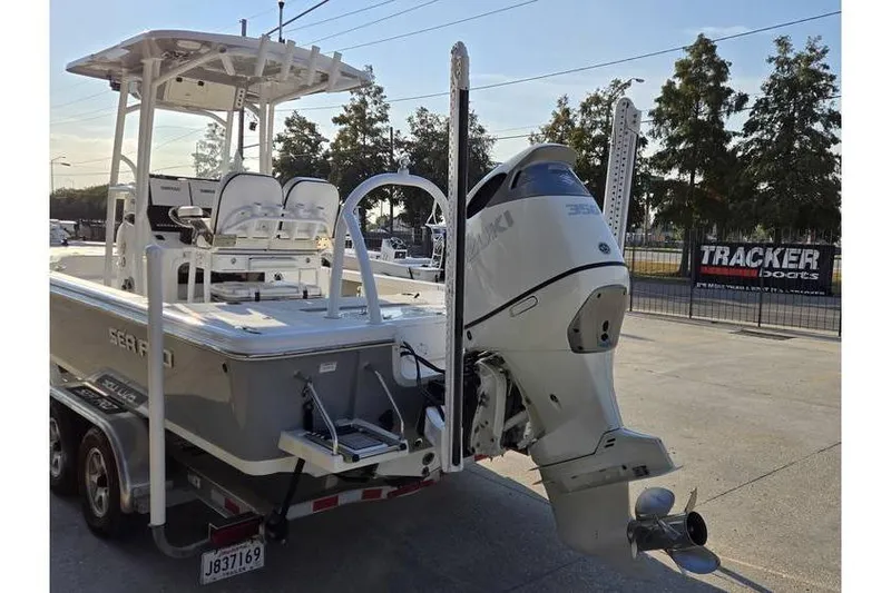 Slide: The Image of 2021 Sea Pro 248 Bay boat with Suzuki outboard motor on trailer. - 5
