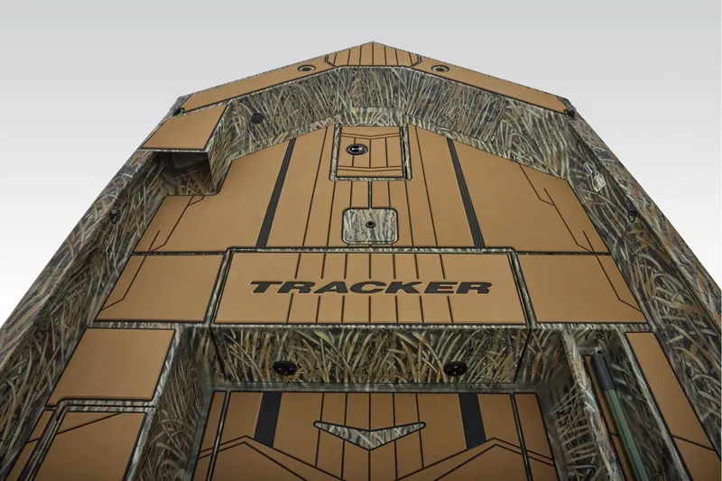 Slide: The Image of 2026 Tracker Grizzly 1756 T Marsh boat with camo design and spacious deck. - 5