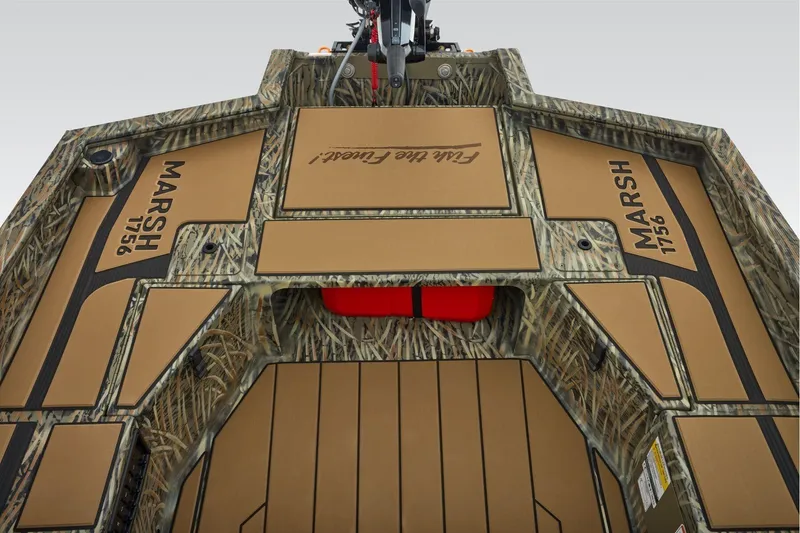 Slide: The Image of 2026 Tracker Grizzly 1756 T Marsh boat interior with camo design and "MARSH 1756" branding. - 6