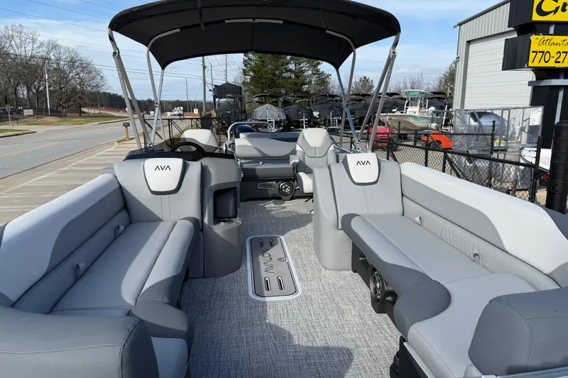 Slide: The Image of 2026 Avalon LSZ Versatile Rear Lounger pontoon boat with spacious seating and canopy. - 12